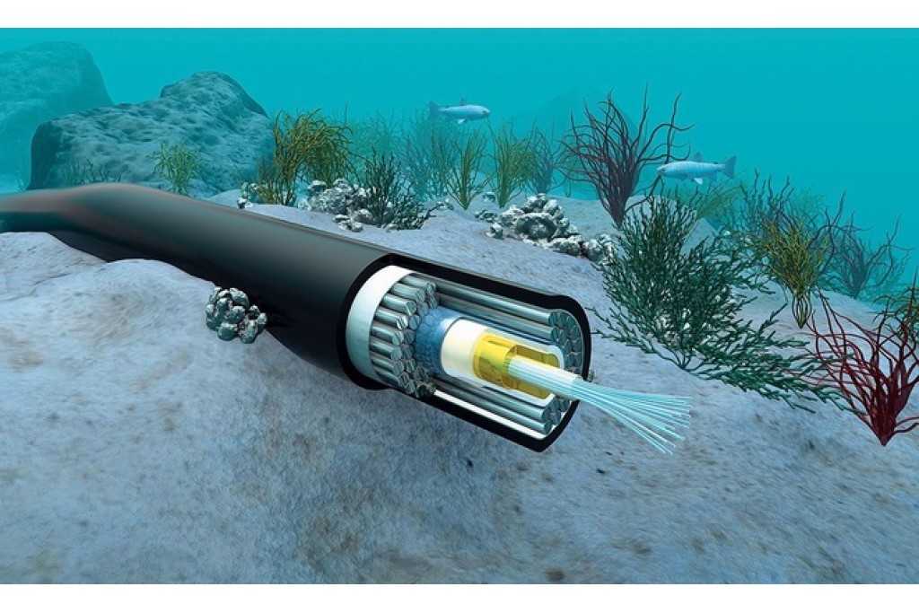 How are fiber optic cables laid on the ocean floor?